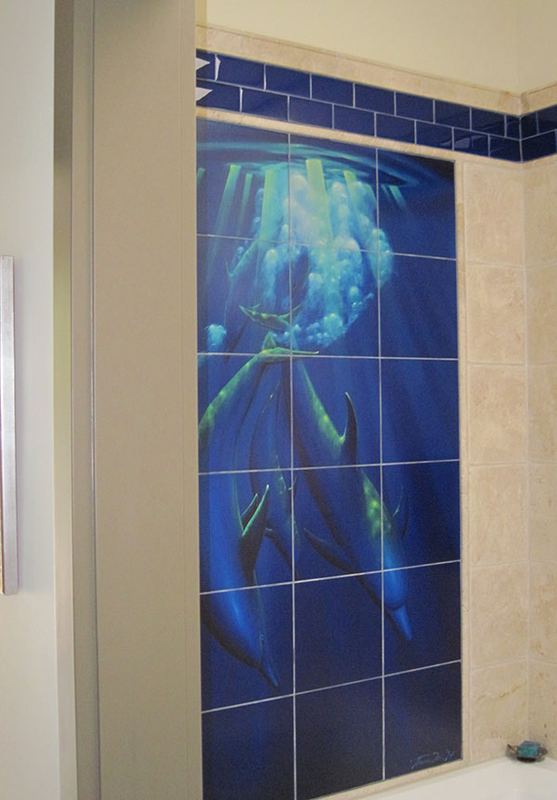 Ocean scene mural in blue tile covering a full wall.